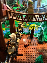 a lego scene with soldiers and a bridge