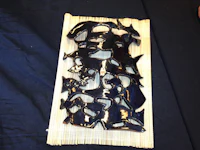 a black piece of wood on a table