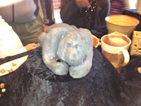 a sculpture of a bear on top of a table