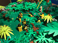 a lego model of a jungle with people in it