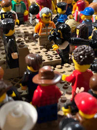 a group of lego people gathered around a table