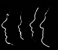 a black and white image of a group of people's faces