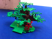 a lego tree on a blue surface